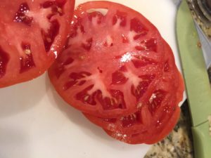 Fresh, ripe, sliced tomato